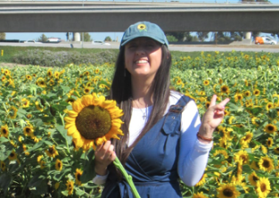 Maria holding a sunflower