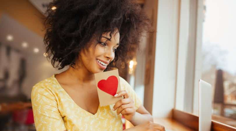 Online Dating Woman holding a Paper Heart