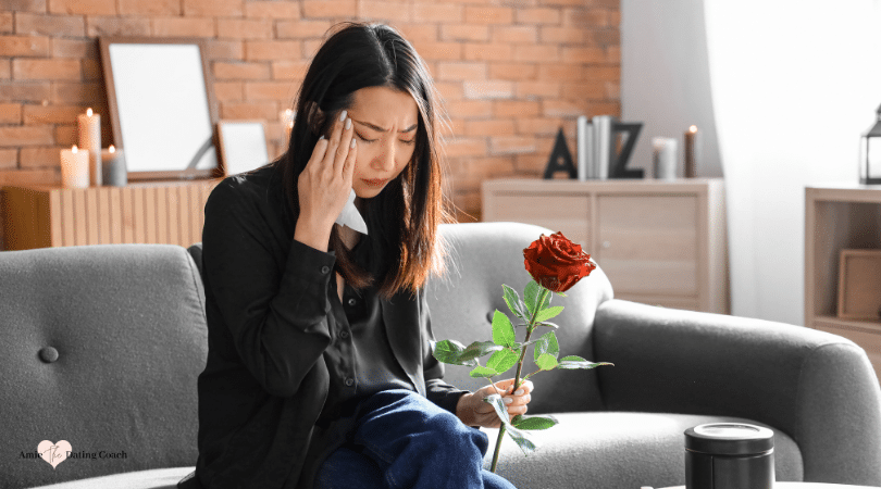 crying woman with a rose in her hand