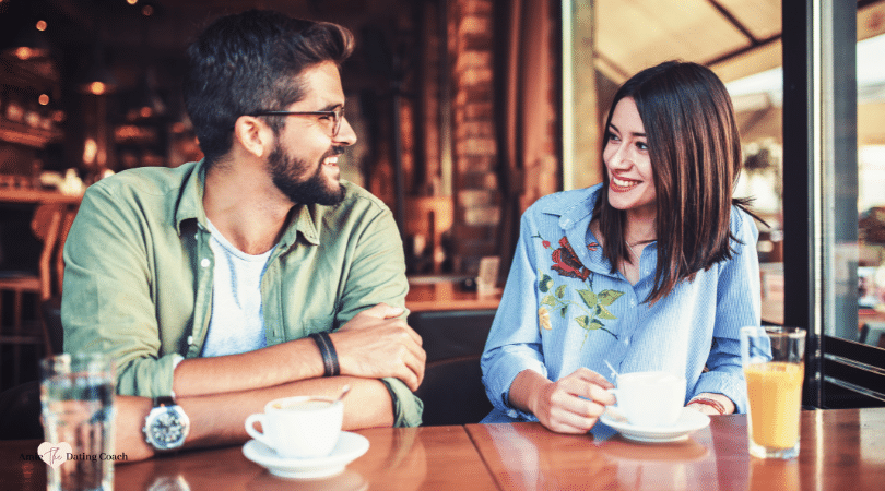 Couple sitting at the table having coffee