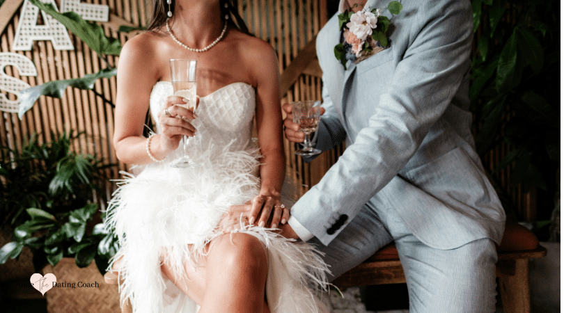 woman and man in wedding attire sitting next to each other.